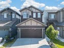Contemporary two-story exterior featuring a two-tone facade with dark siding and light trim - 4620 Alwood Way Sw, Edmonton, AB  - Outdoor With Facade 