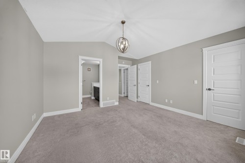Spacious room with vaulted ceilings and light gray wall paint - 4620 Alwood Way Sw, Edmonton, AB - Indoor Photo Showing Other Room