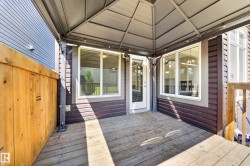 Covered outdoor deck featuring wood-finish flooring - 