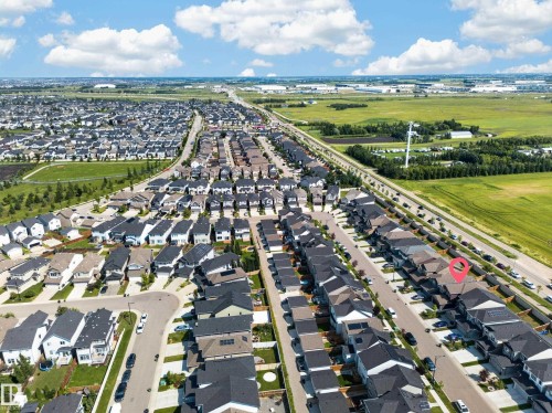 Aerial perspective showcasing a residential neighborhood with varied housing styles - 4620 Alwood Way Sw, Edmonton, AB - Outdoor With View