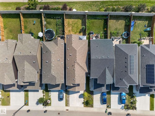 Aerial view showcasing multiple residential properties with varied rooflines and rear yards - 4620 Alwood Way Sw, Edmonton, AB - Outdoor