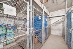 Secure storage area featuring chain-link enclosures with numbered doors - 