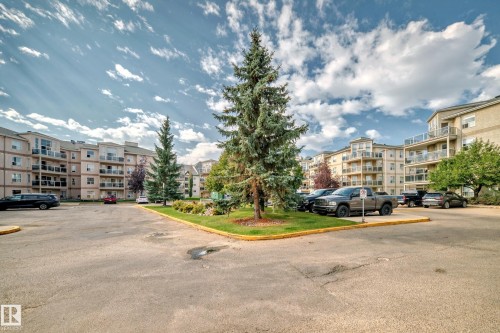 Multi-story residential buildings with tan exteriors - #201 9760 174 St Nw, Edmonton, AB - Outdoor