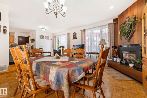8704 43 Avenue Nw, Edmonton, AB - Indoor Photo Showing Dining Room With Fireplace