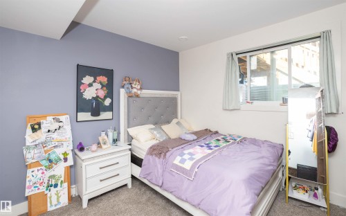 Bedroom featuring a recessed light, soft gray carpeting, and a window with a white frame - 62503A Hwy 769, Rural Barrhead County, AB - Indoor Photo Showing Bedroom
