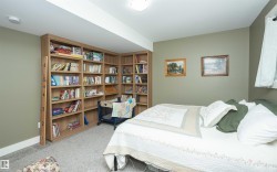Light-colored carpeting complements warm gray wall tones and white trim - 