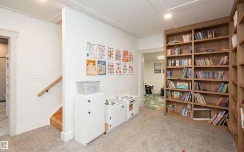 Built-in wood-finish shelving unit provides ample storage - 62503A Hwy 769, Rural Barrhead County, AB - Indoor