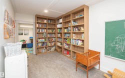 Built-in wood-finish shelving providing extensive storage - 