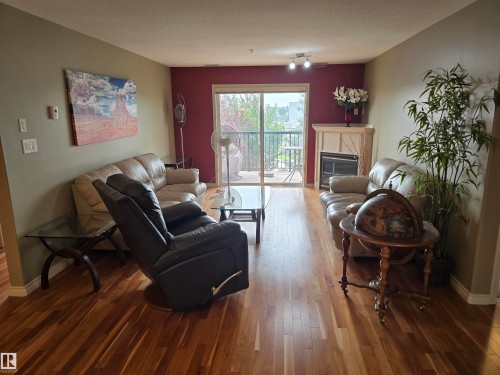 #337 2096 Blackmud Creek Dr Sw, Edmonton, AB - Indoor Photo Showing Living Room With Fireplace