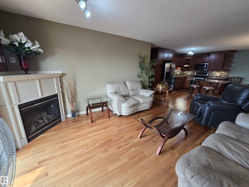 #337 2096 Blackmud Creek Dr Sw, Edmonton, AB - Indoor Photo Showing Living Room With Fireplace