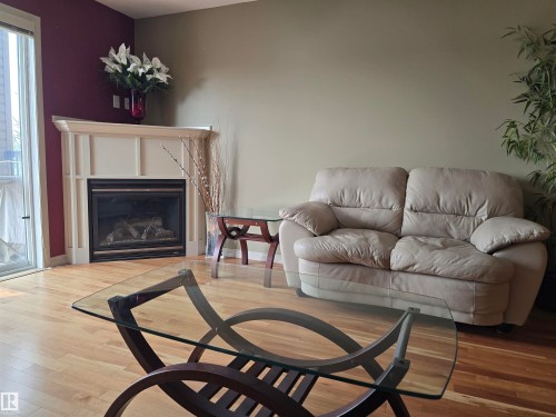 #337 2096 Blackmud Creek Dr Sw, Edmonton, AB - Indoor Photo Showing Living Room With Fireplace