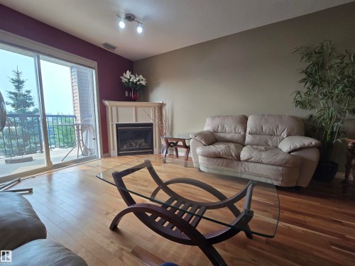 #337 2096 Blackmud Creek Dr Sw, Edmonton, AB - Indoor Photo Showing Living Room With Fireplace
