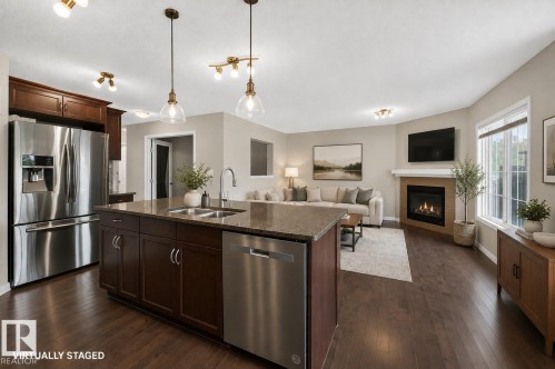 3906 6 Street Nw, Edmonton, AB - Indoor Photo Showing Kitchen With Fireplace With Stainless Steel Kitchen With Double Sink With Upgraded Kitchen