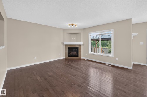 3906 6 Street Nw, Edmonton, AB - Indoor Photo Showing Living Room With Fireplace