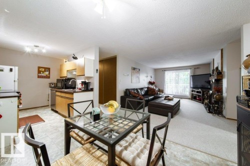 Open-concept living space featuring a combined kitchen and living area - #307 6212 180 St Nw, Edmonton, AB - Indoor