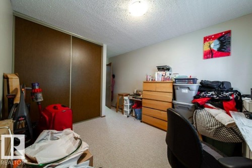 Room featuring light-colored carpet flooring and a neutral wall palette - #307 6212 180 St Nw, Edmonton, AB - Indoor