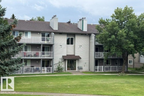 Three-story multi-unit building featuring individual balconies and ground-level patios - #307 6212 180 St Nw, Edmonton, AB - Outdoor
