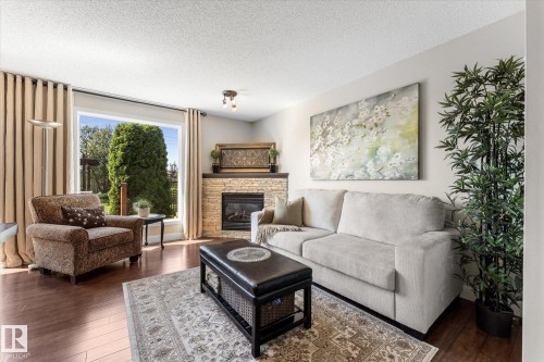 2948 26 Street Nw, Edmonton, AB - Indoor Photo Showing Living Room With Fireplace