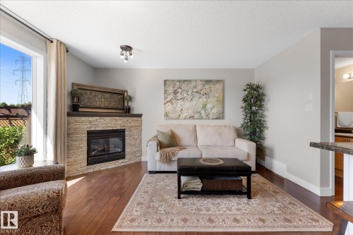 2948 26 Street Nw, Edmonton, AB - Indoor Photo Showing Living Room With Fireplace