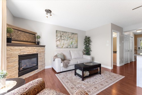 2948 26 Street Nw, Edmonton, AB - Indoor Photo Showing Living Room With Fireplace