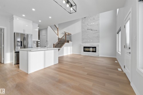 47 Axelwood Crescent, Spruce Grove, AB - Indoor Photo Showing Kitchen With Fireplace With Upgraded Kitchen