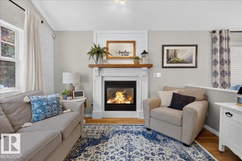 1012 79 Street Sw, Edmonton, AB - Indoor Photo Showing Living Room With Fireplace