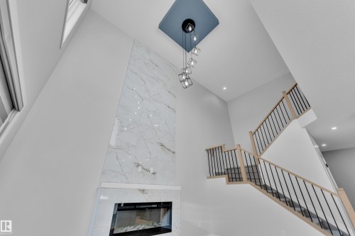 41 Axelwood Crescent, Spruce Grove, AB - Indoor Photo Showing Other Room With Fireplace