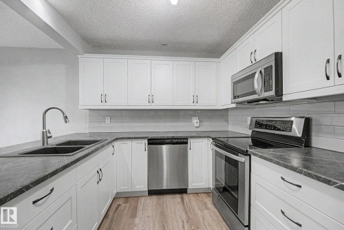 #7 10 Devon Cl, St. Albert, AB - Indoor Photo Showing Kitchen With Stainless Steel Kitchen With Double Sink