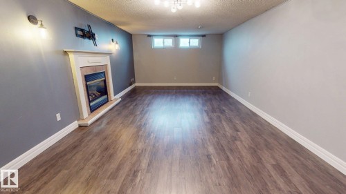 10661 152 Street Nw, Edmonton, AB - Indoor Photo Showing Other Room With Fireplace
