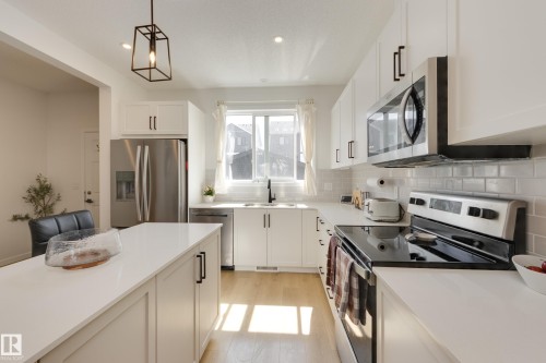 19281 22A Avenue Nw, Edmonton, AB - Indoor Photo Showing Kitchen With Stainless Steel Kitchen With Upgraded Kitchen