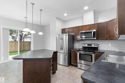#7 13825 155 Av Nw, Edmonton, AB - Indoor Photo Showing Kitchen With Double Sink