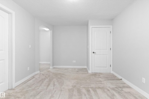 #7 13825 155 Av Nw, Edmonton, AB - Indoor Photo Showing Other Room