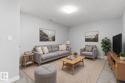#7 13825 155 Av Nw, Edmonton, AB - Indoor Photo Showing Living Room