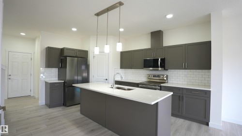 #2 2710 66 St Sw, Edmonton, AB - Indoor Photo Showing Kitchen With Double Sink With Upgraded Kitchen