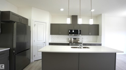 #2 2710 66 St Sw, Edmonton, AB - Indoor Photo Showing Kitchen With Double Sink With Upgraded Kitchen