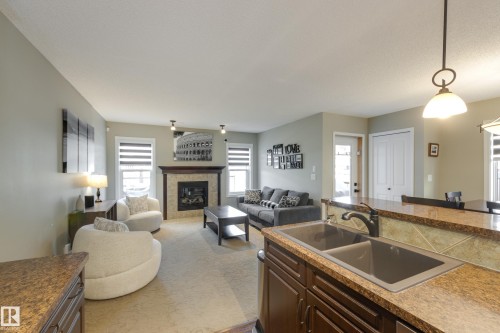 5881 168A Avenue Nw, Edmonton, AB - Indoor Photo Showing Living Room With Fireplace