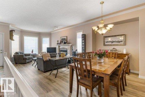 #27 170 Kingswood Bv, St. Albert, AB - Indoor Photo Showing Dining Room With Fireplace