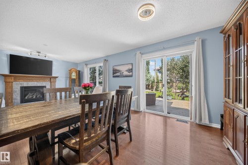 90 Rue Montalet, Beaumont, AB - Indoor Photo Showing Dining Room With Fireplace