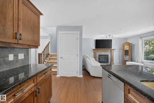 90 Rue Montalet, Beaumont, AB - Indoor Photo Showing Kitchen With Fireplace