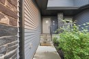 Modern exterior featuring dark gray siding and stone accents - 1860 Keene Crescent Sw, Edmonton, AB  - Outdoor 
