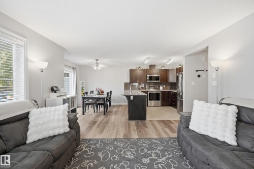 Open-concept living space featuring wood-finish flooring - 3606 Whitelaw Bay Nw, Edmonton, AB - Indoor Photo Showing Living Room