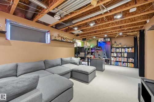 Finished lower level with exposed beam ceiling and recessed lighting - 3606 Whitelaw Bay Nw, Edmonton, AB - Indoor Photo Showing Basement