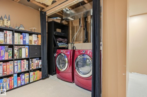 Dedicated laundry area featuring a front-loading washing machine and dryer - 3606 Whitelaw Bay Nw, Edmonton, AB - Indoor Photo Showing Laundry Room