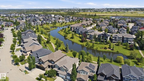 Expansive aerial perspective showcasing a residential development with numerous single-family homes - 3606 Whitelaw Bay Nw, Edmonton, AB - Outdoor With View