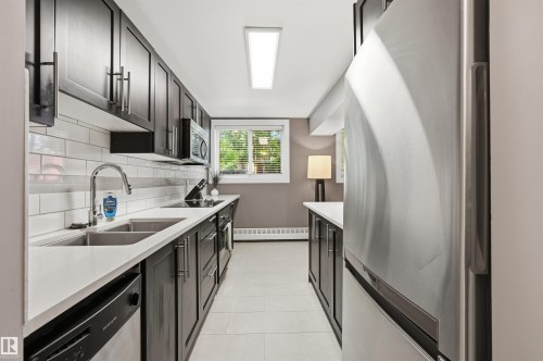 #1 10015 83 Av Nw Nw, Edmonton, AB - Indoor Photo Showing Kitchen With Double Sink With Upgraded Kitchen
