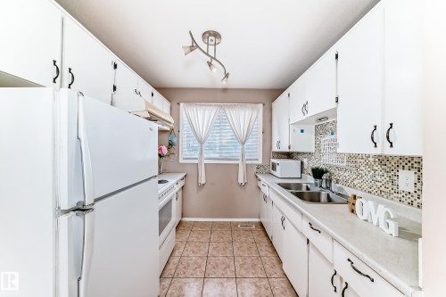 100 Dickinsfield Crest Nw, Edmonton, AB - Indoor Photo Showing Kitchen With Double Sink