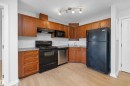 #221 240 Spruce Ridge Rd, Spruce Grove, AB  - Indoor Photo Showing Kitchen With Double Sink 