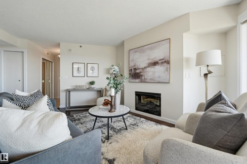 #1003 12319 Jasper Av Nw, Edmonton, AB - Indoor Photo Showing Living Room With Fireplace