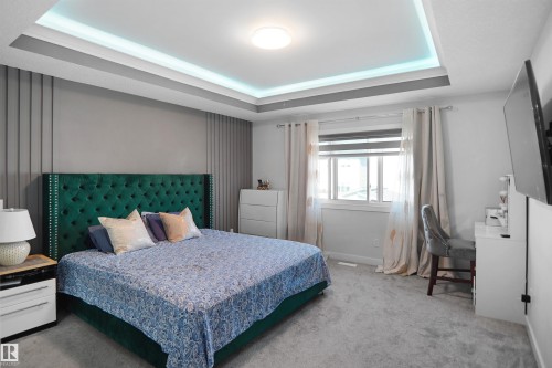 Recessed tray ceiling with integrated lighting - 4003 39 Street, Beaumont, AB - Indoor Photo Showing Bedroom