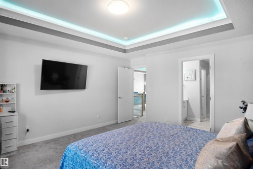 Recessed ceiling with integrated lighting - 4003 39 Street, Beaumont, AB - Indoor Photo Showing Bedroom